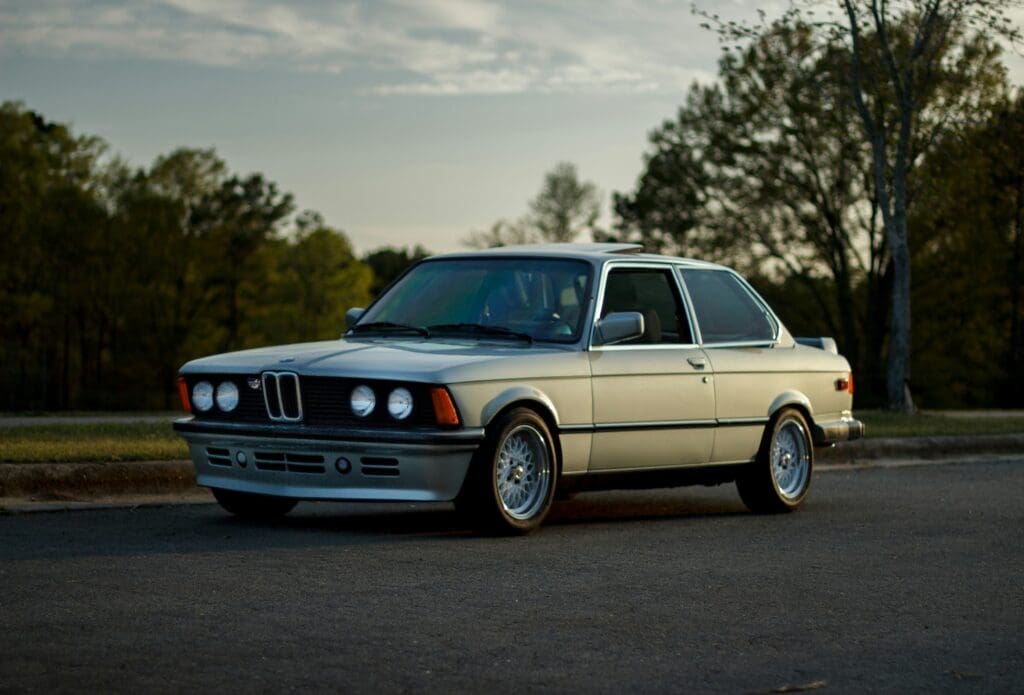 Side image of a BMW e30 fully restored