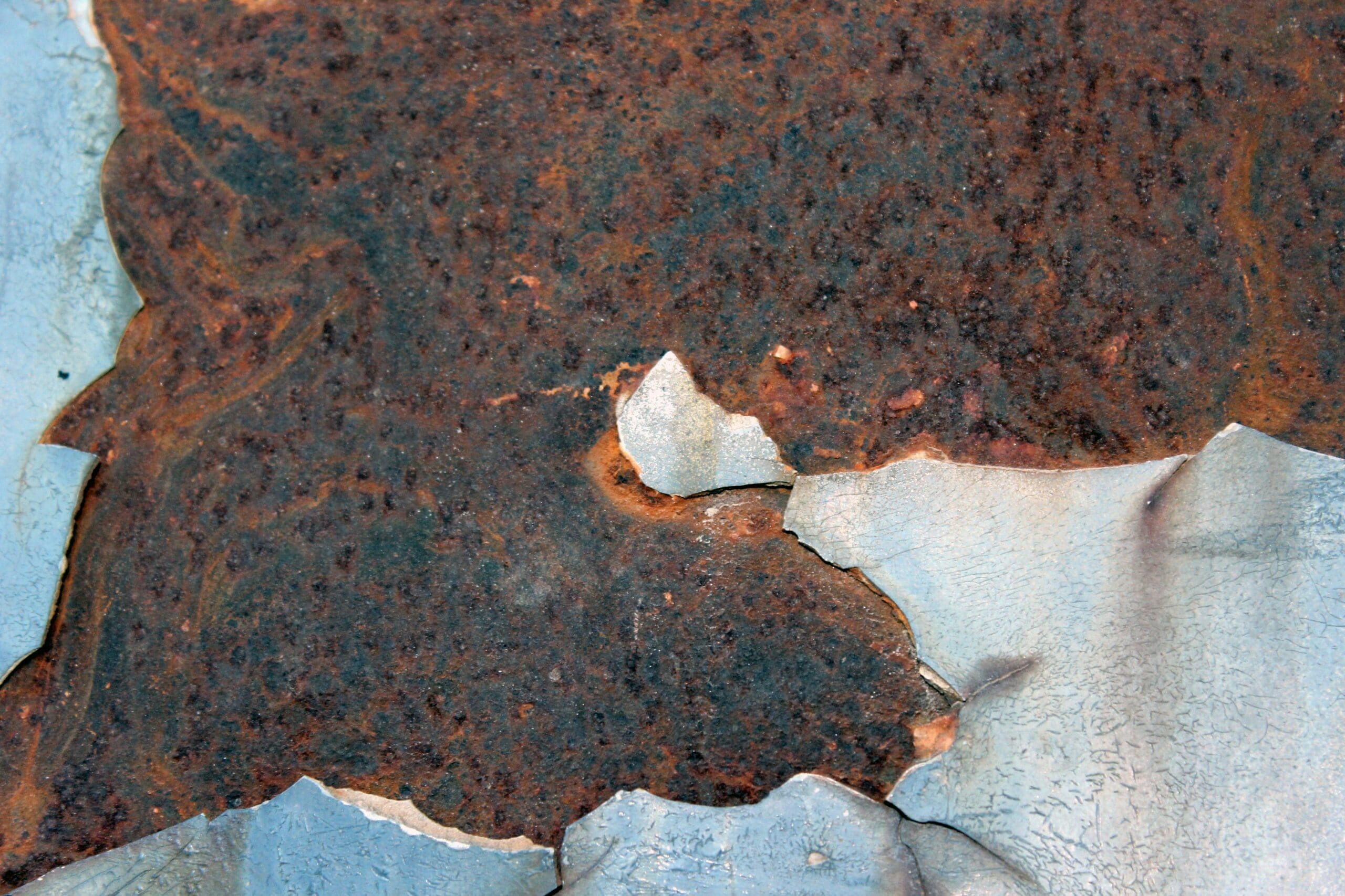 close up of rust on a car
